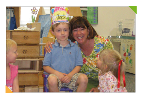 Educational consulting experting expert Kim Hughes with a young student in classroom environment